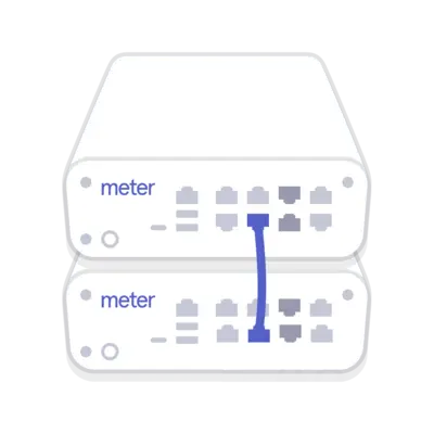 Two Meter network switches connected via uplink cable